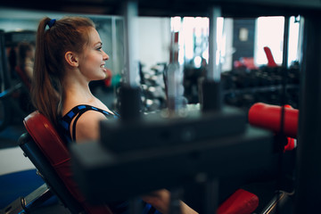 Young woman exercising. Fitness in gym.