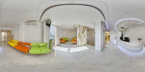 Panorama of the waiting area in a medical confinement near the reception with multi-colored sofas...