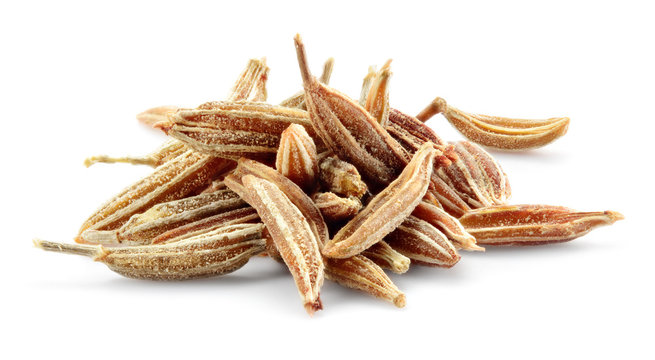 Cumin seeds macro. Caraway isolated on white background.
