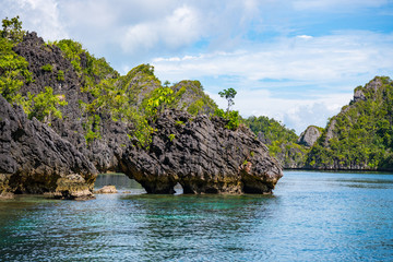 East Misool, group of small island in shallow blue lagoon water, Raja Ampat, West Papua, Indonesia