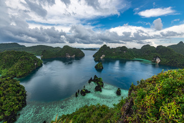 East Misool, group of small island in shallow blue lagoon water, Raja Ampat, West Papua, Indonesia