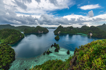 Obraz premium East Misool, group of small island in shallow blue lagoon water, Raja Ampat, West Papua, Indonesia