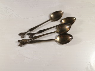 a few teaspoons on the table