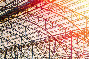 Railway station steel srame structure with space frame roof In the warm orange rays of the sun....