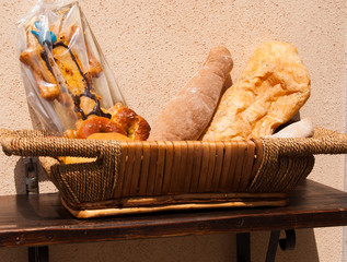 Basket of traditional foods on a wooden shelf