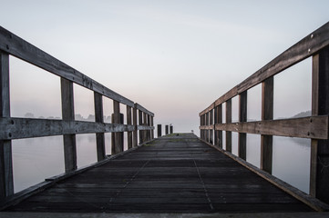 Fototapeta premium Jetty in the morning sun on a misty day