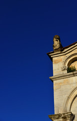 Corner of Lucca medieval Church of Santa Maria Forisportam facade, completed in the 12th century (with blue sky and copy space)