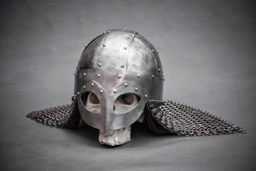 Skull in a Viking helmet, on a gray background