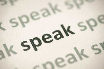 word speak printed on paper macro