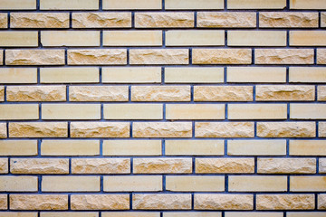 Brick masonry with  different brick structure. Modern finishing materials in construction_
