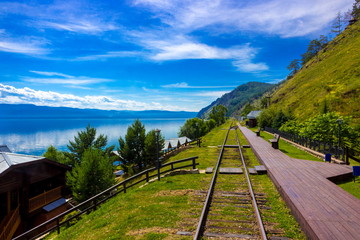 Majestic summer landscape on Lake Baikal for travel background with wooden deserted platform...