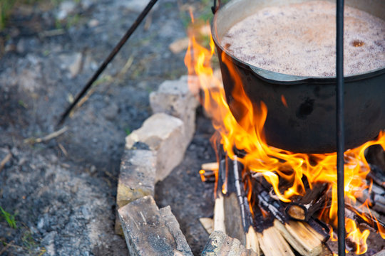 cooking in a cauldron at the stake