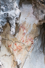 Prehistoric petroglyph rock paintings in Misool, Raja Ampat, West Papua, Indonesia by aborigines, 3,000 to 5,000 years ago