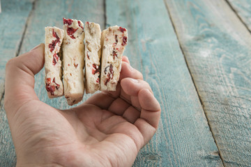 Hand Holding The Traditional Pieces Of White Nougat