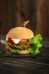 burgers on a slate plate  - fast food (sandwich) - cuisine.  Food background