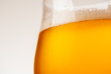 Glass of beer on white background