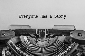 Everyone has a story, typed words on a vintage typewriter. old paper. close-up