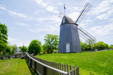 Landscape photograph of a windmill in one of the towns on Long Island, New York. - obrazy, fototapety, plakaty