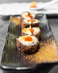 Sushi, a typical Japanese food prepared with a base of rice and various raw fish. Here it is served with a particular and modern style.