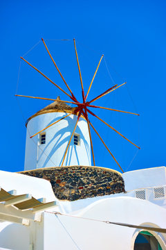 Traditional white windmill in Santorini,