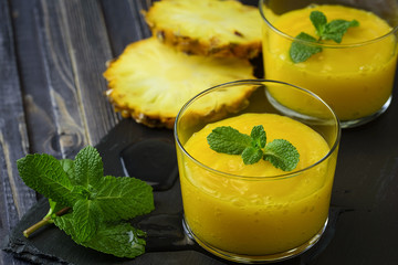 Homemade mango and pineapple smoothie made with coonut milk