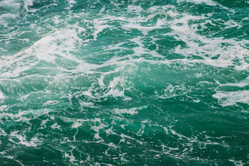The surging sea water background. Texture