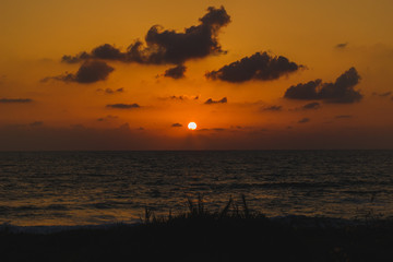 Fototapeta na wymiar Sunset on a Mediterranean sea. Light and clouds.