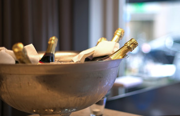 Bottles of champagne in an ice vase. Party preparation   