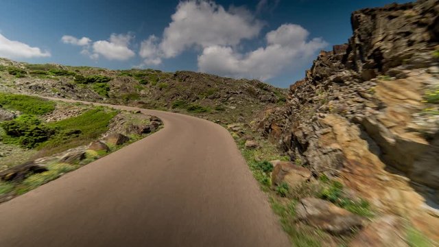 pov of a drive in the beautiful cap de creus national park coastline in catalunya, spain