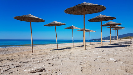 sea beach umbrellas in preveza kanali greece