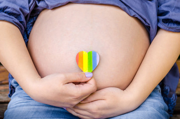 Pregnant woman shows on camera heart LGBT Pride Rights Lesbian Gay Bisexual Transgender Geek on...