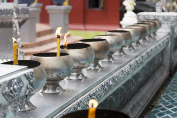 Candles in a Buddhist temple in Chiang Mai Thailand
