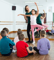 satisfied boys and girls rehearsing ballet dance in studio © JackF