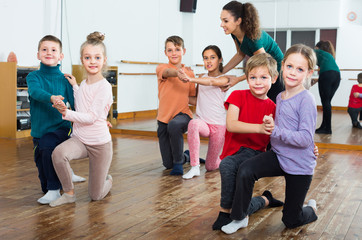 positive little boys and girls dancing pair dance