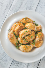 Mini chicken pies on the white plate