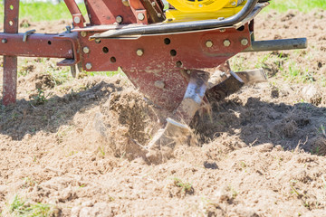 close up of small hand tractor (motoblock) for plowing field.