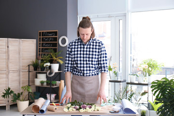 Handsome male florist at workplace