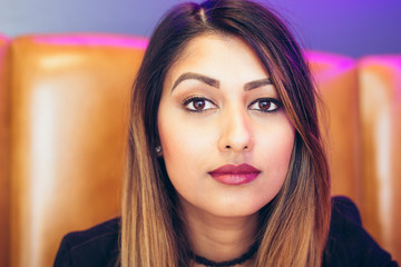 Portrait of young businesswoman sitting in office