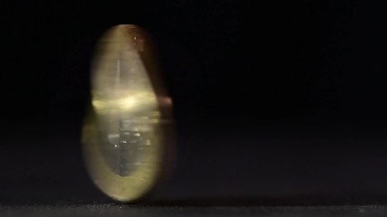 One euro coin spinning on table - Powered by Adobe