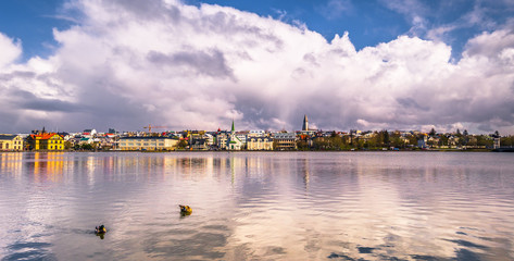 Fototapeta premium Reykjavik - May 02, 2018: Panorama of Reykjavik from the Tjornin Lake, Iceland