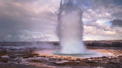 Geysir - May 03, 2018: A tall geyser eruption at Geysir, Iceland