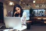 Businesswoman working on laptop in office