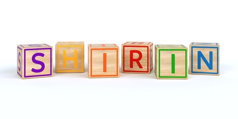 The name shirin written with Isolated wooden toy cubes