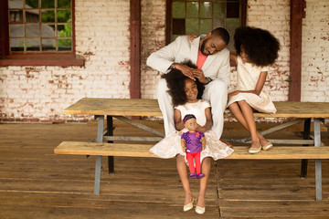 Father styling daughter's hair