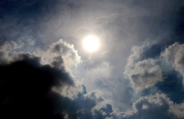 Obraz premium dark clound with blue sky and sun ray