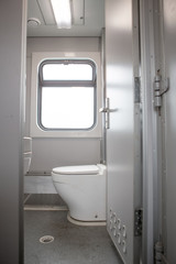 Classic toilet interior on the train. Toilet in the passenger train