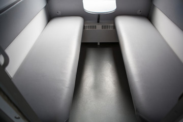 classic interior of sleeping car of train. interior of compartment car. Passenger train car. Sleeping car of passenger train