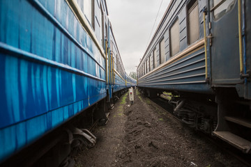 Obraz premium Classical cars of passenger train from outside. Many passenger cars.