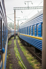 Fototapeta premium Classical cars of passenger train from outside. Many passenger cars.