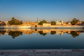 Waterfront Reflection of Houses in Bikaner India 